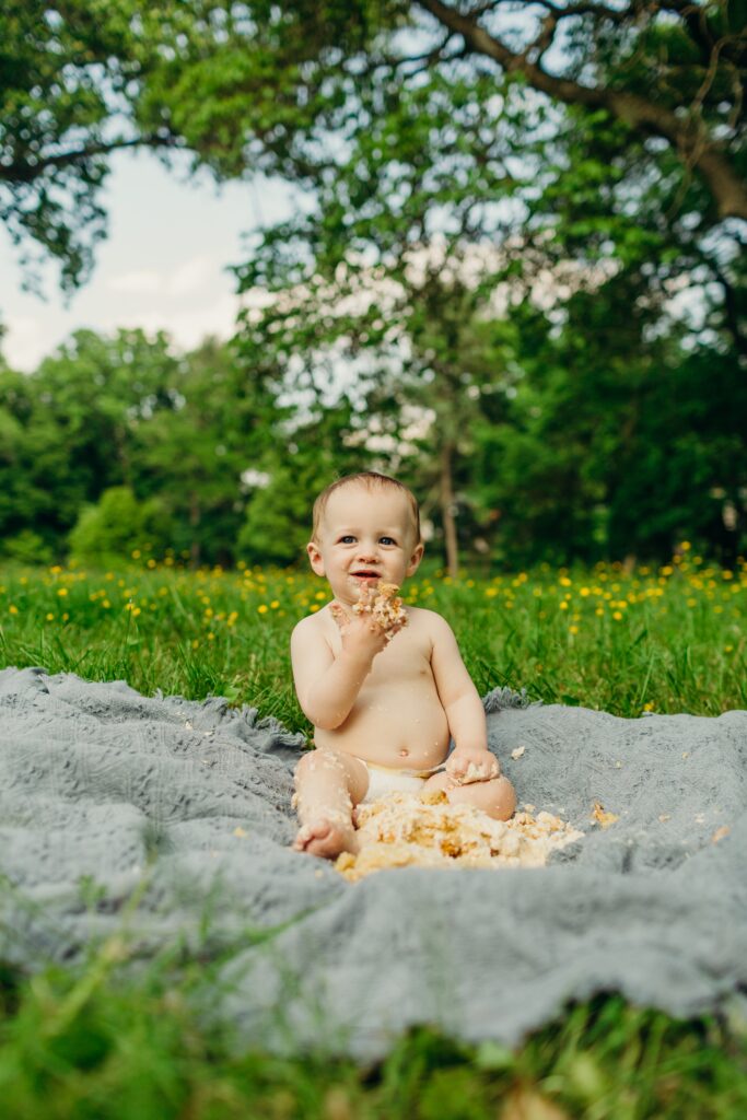 a one year old during his cake smash photoshoot in a Philadelphia Park 