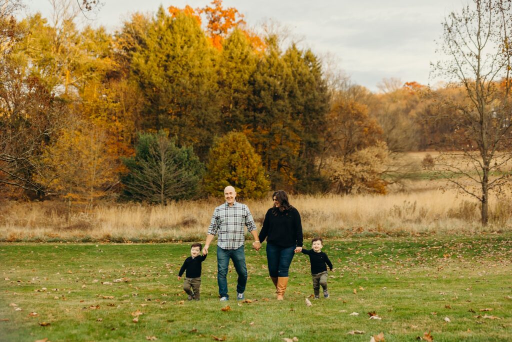 a family of four in a Philadelphia park for their Fall family photos