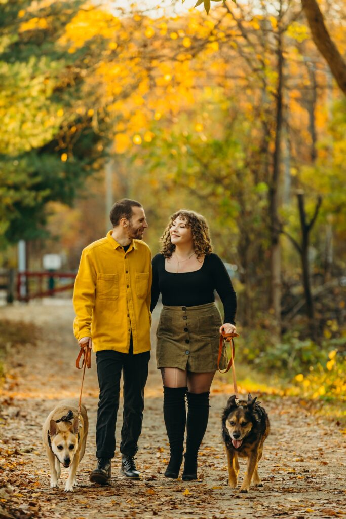 A Philadelphia fall lifestyle pet photo session with 2 dogs and a couple 