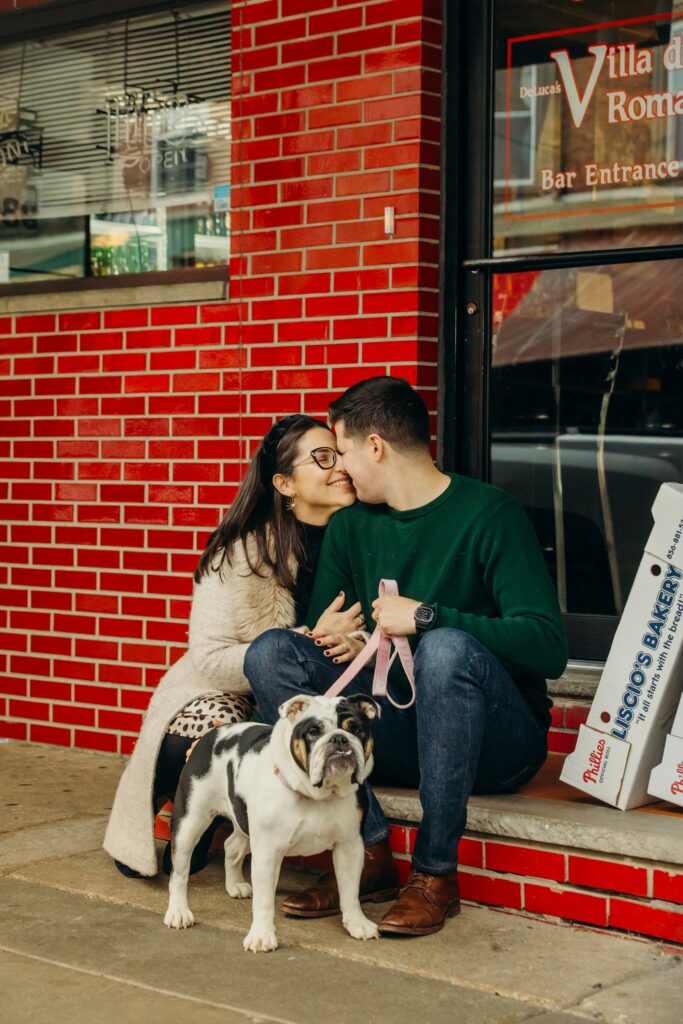 a Philadelphia couple with their bulldog during a photoshoot in South Philadlephia