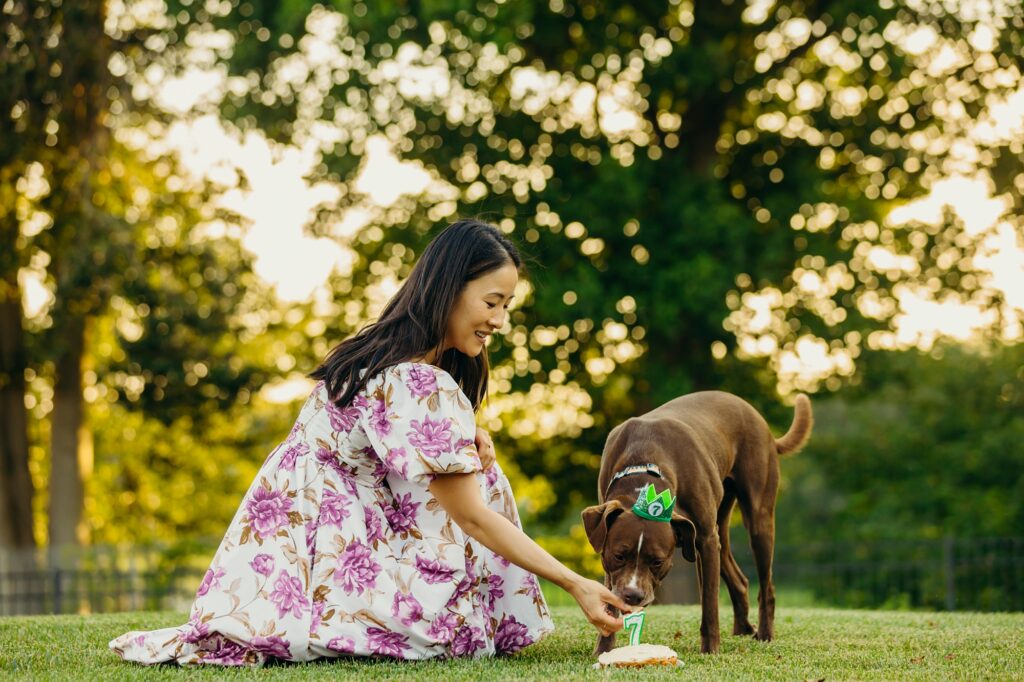 a Philadelphia woman lighting her dog's birthday cake during Dog birthday photoshoot 