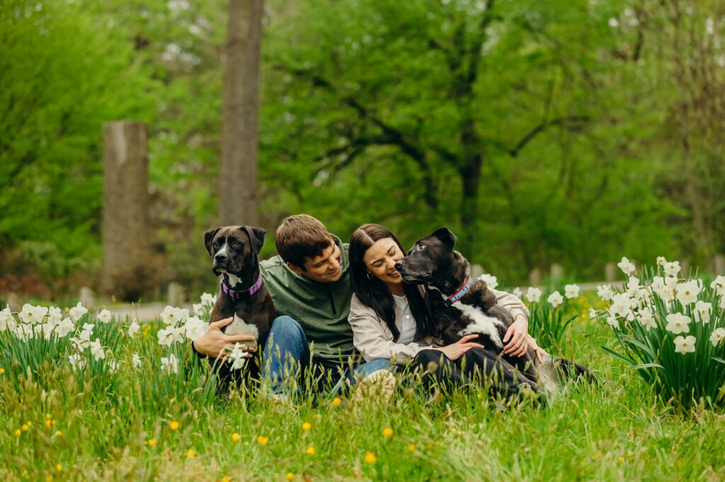 a Philadelphia couple with their dogs at a garden during a Spring photoshoot 