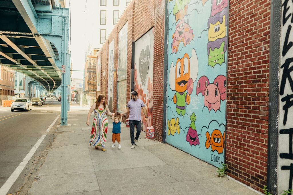 A Philadelphia family walking through Fishtown during their summer photoshoot. 