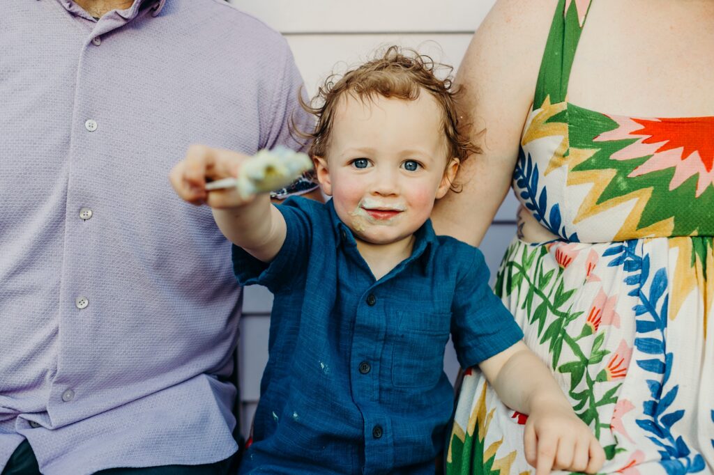 A toddler eating ice cream during a summer family session in Philadelphia. 