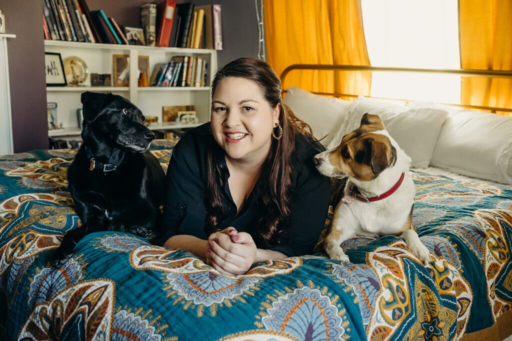 A philadelphia woman during her at home pet session with her two dogs 