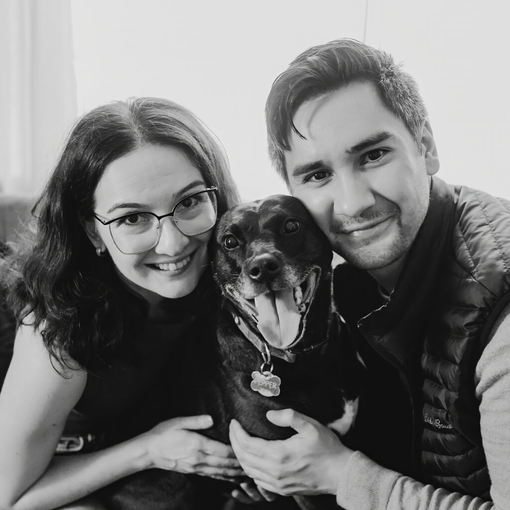 a Philadelphia couple with their black dog during a Philadelphia pet session 
