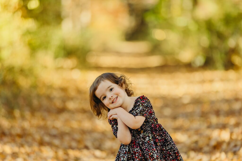 a cute young girl during a fall family session in Southern New Jersey. 