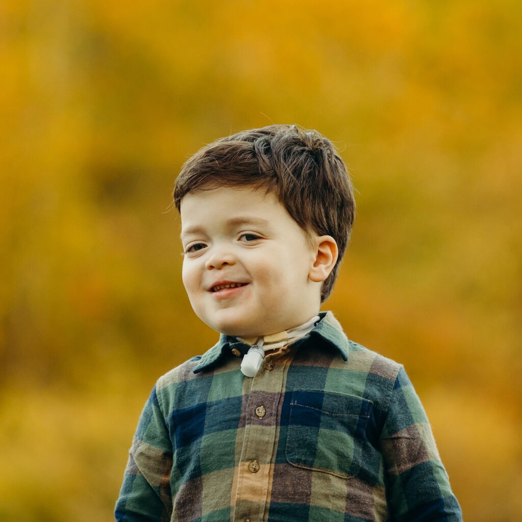 a portrait of a young boy during his fall family session at Valley Forge in Pennsylvania. 