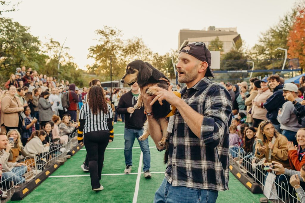 Lucky's Wiener Race competitor celebrating at the PAWS Philly event. 
