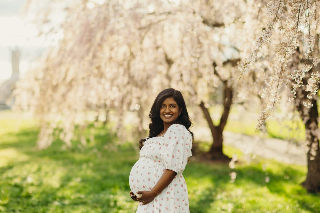 Cherry blossom maternity photoshoot in Fairmount Park at the Horticulture Center in Philadelphia, Pennsylvania. 