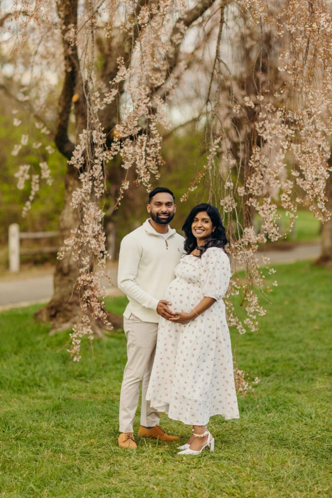 A stunning spring maternity photoshoot at Philadelphia's Horticulture Center surrounded by the cherry blossoms. 