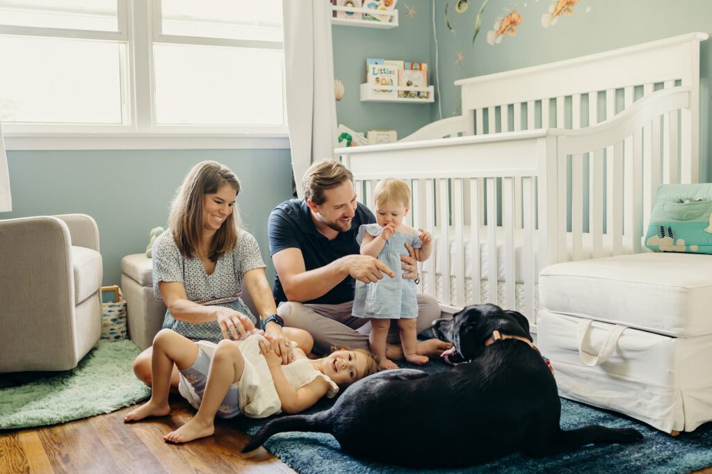 a lifestyle family session with 2 young girls and a black lab in Cherry hill, New jersey 