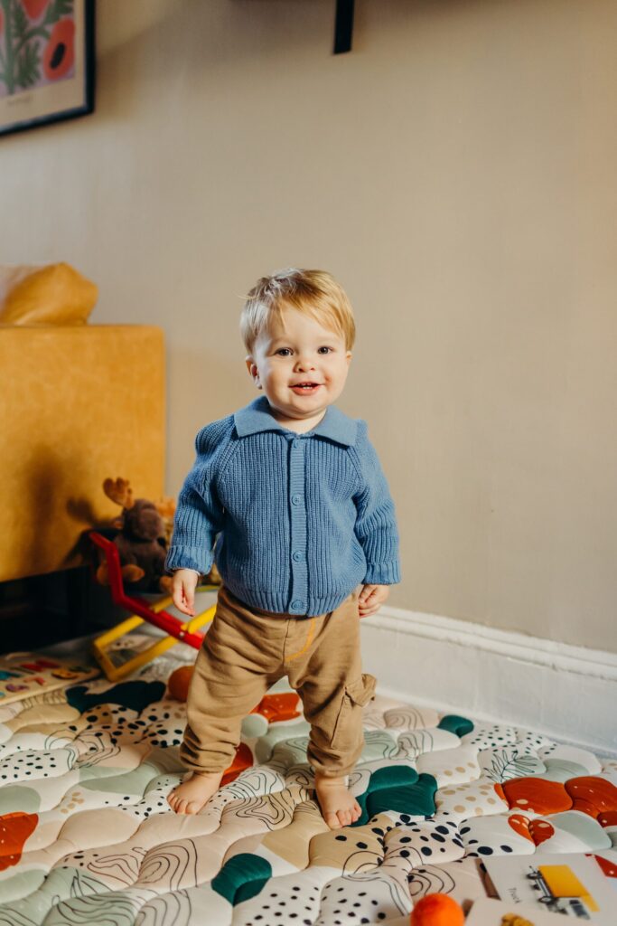a cute baby boy during an at home family session in Fairmount Philadelphia. 
