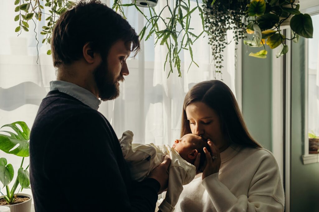 intimate at home newborn session in South Philadelphia with a young couple. 