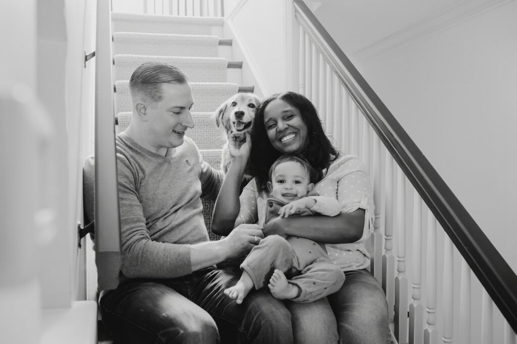 A Norristown, PA family during their at-home photo session with a baby and dog
