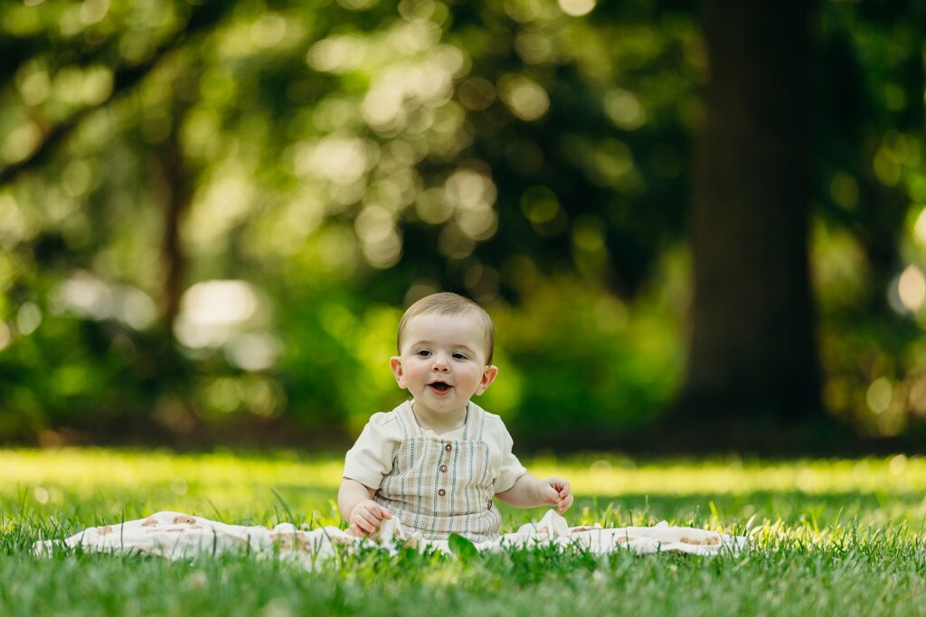baby boy smiling during an outdoor family photo session in Fairmount Park